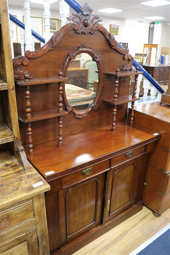 A Victorian walnut chiffonier with carved mirrored superstructure W.104cm